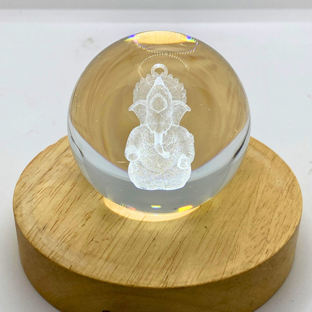 SNOOGG 3D LORD Ganesh  Crystal Ball, Crafted Using Advanced Laser Techniques. Glass Art Features a Stunning Universe Design with a 3.5-inch Wooden Display Base. Multi-Coloured Lighting with Remote